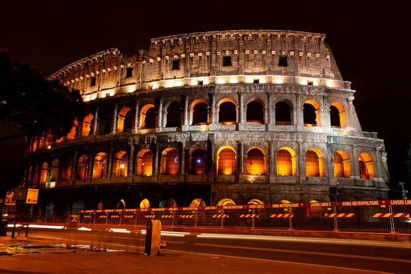 Famous ruins of Colosseum at night time in the capital of Italy Rome. 