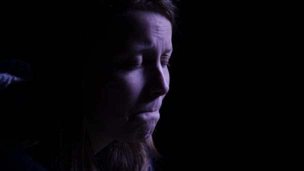 Depressed teen girl is crying in the dark. 4K UHD. — Stock Video