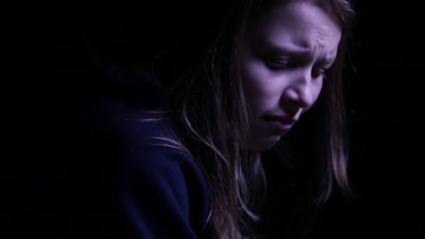 Depressed teen girl is crying in the dark. 4K UHD. — Stock Video