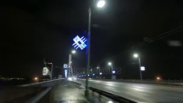 Night city and bridge in fog. Riga, Latvia. December 2016. 4K UHD hyperlapse — Stock Video