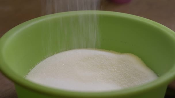 Slow motion of a sugar falling down — Stock Video