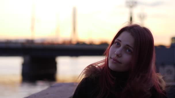 Portrait of a cute pensive smiling teen girl on a night city street. 4K UHD slowmo — Stock Video