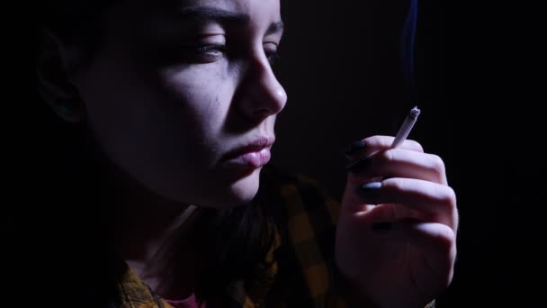 An angry sad teen girl with a cigarette — Stock Video