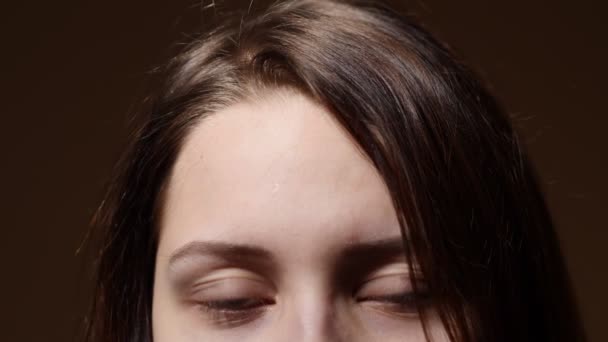 Portrait of a teen girl with a curious suspicious face. Closeup part of a face. — Stock Video