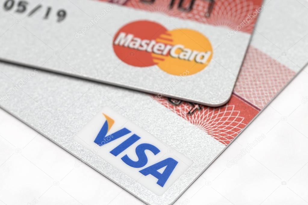 Ostersund, Sweden- July 28, 2017: Visa and Mastercard logos on credit cards. Visa and Mastercard are the two biggest credit card companies