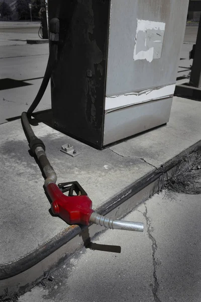 Old Red Gas Pump Handle Laying on Ground — Stock Photo, Image