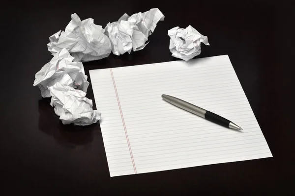 Pen and Paper on Desk with Discarded Trashed Ideas — Stock Photo, Image