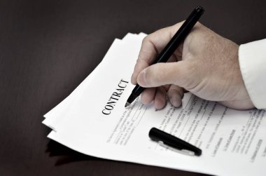 Loan Contract Document on Desk with Black Pen clipart