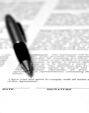 Contract on Desk with Black Pen clipart