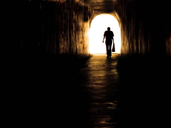 Old Man Walking Through Tunnel — Stock Photo, Image