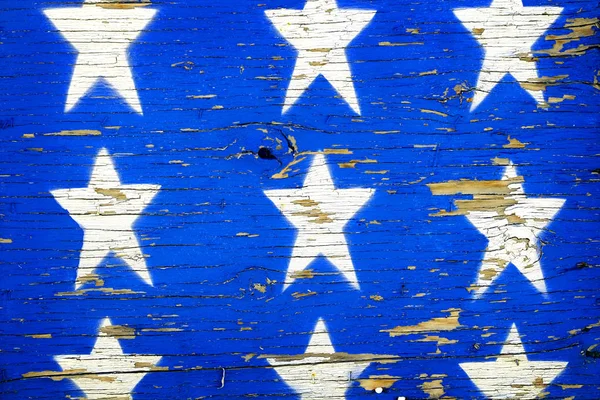 Niebieskie gwiazdy na szorstkie drewno malowane — Zdjęcie stockowe