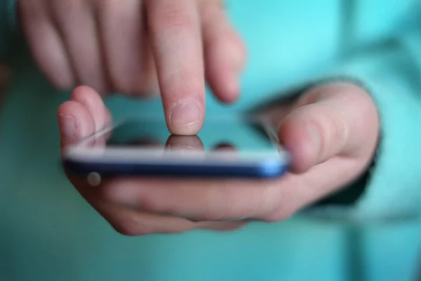 Finger on an Smart Phone Exploring Data — Stock Photo, Image