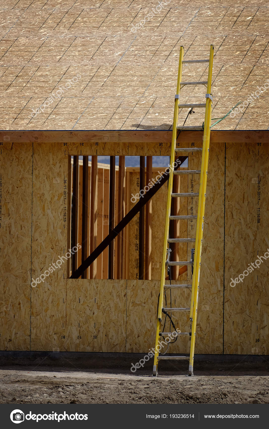 Construction Site with Yellow Ladder Rough Boards Stock Photo by