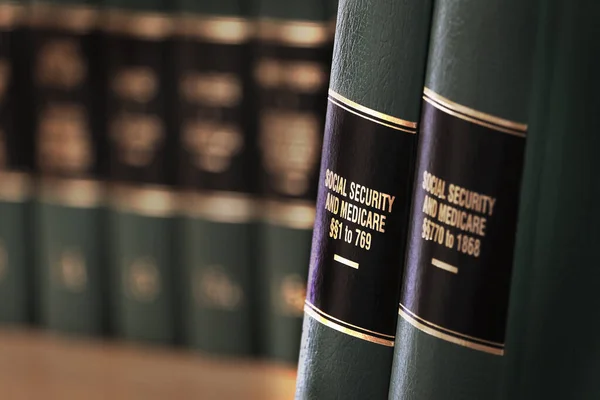 Social Security Medicaid Benefits Legal Law Books Shelf — Stock Photo, Image