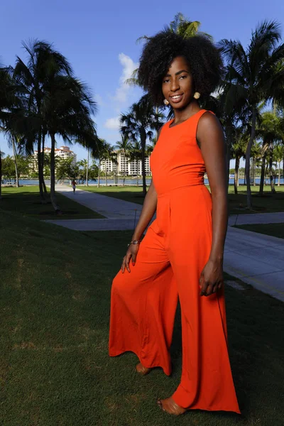 Woman in a retro orange jumpsuit — Stock Photo, Image