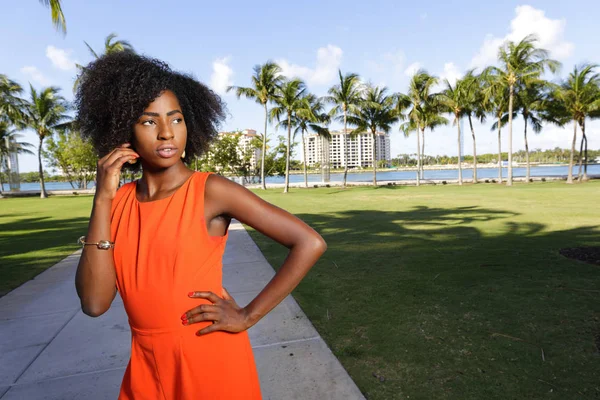 Woman in a retro orange jumpsuit — Stock Photo, Image