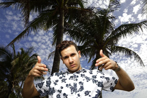 Man showing hand guns to the camera — Stock Photo, Image