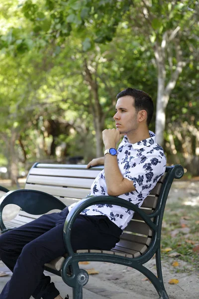 Man sitting and thinking on a bench — Stock Photo, Image