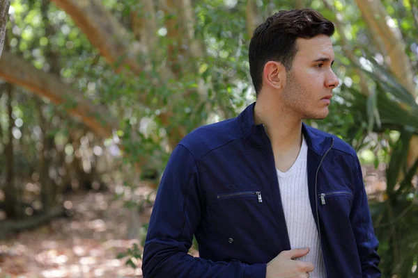 Man looking away from camera with unzipped jacket — Stock Photo, Image