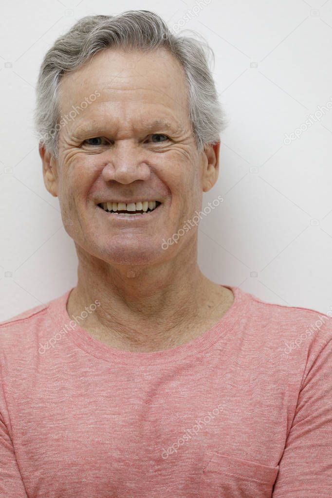 Handsome 65 year old man  smiling at camera  Stock Photo 