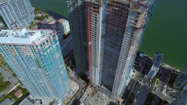 Aerial Pull Out Reveal Highrise Buildings City Construction Cranes — Stock Video