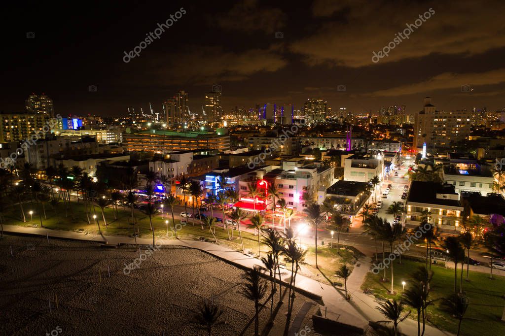 Image of Miami Beach Ocean Drive at night view of art deco hotels logos removed