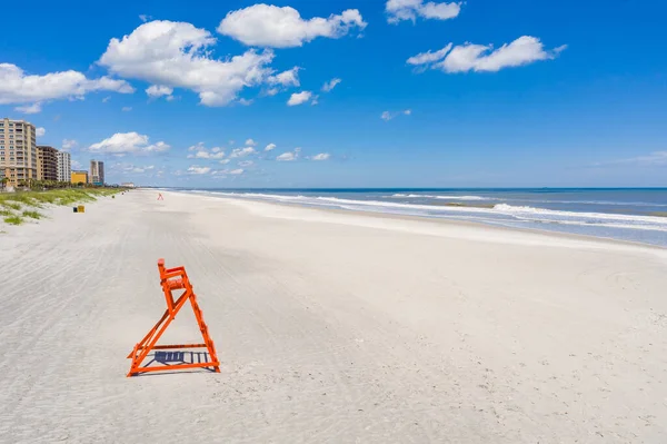 Empty lifeguard chairs at Jacksonville Beach during Coronavirus Covid 19 pandemic shut down