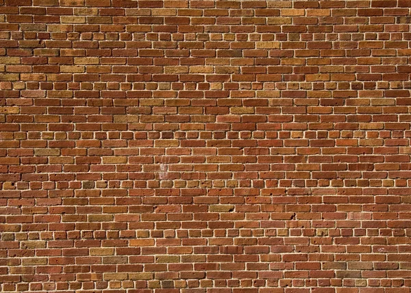 Kırmızı tuğla duvar desen arka planda bina