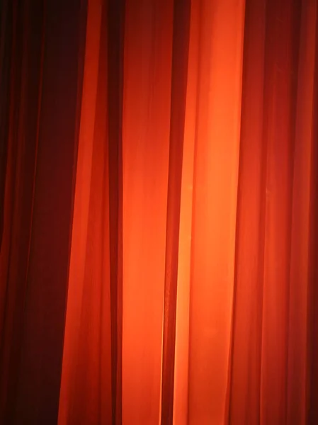 Spot Light Against Curtain Red Background Design