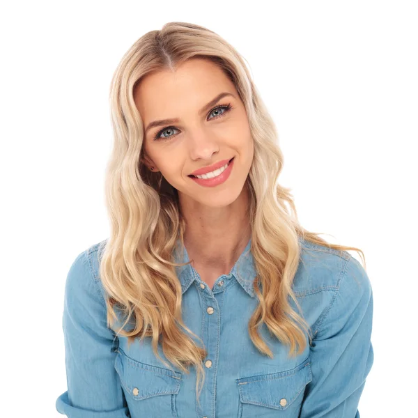 Portrait of a young blonde woman in jeans shirt smiling — Stock Photo, Image