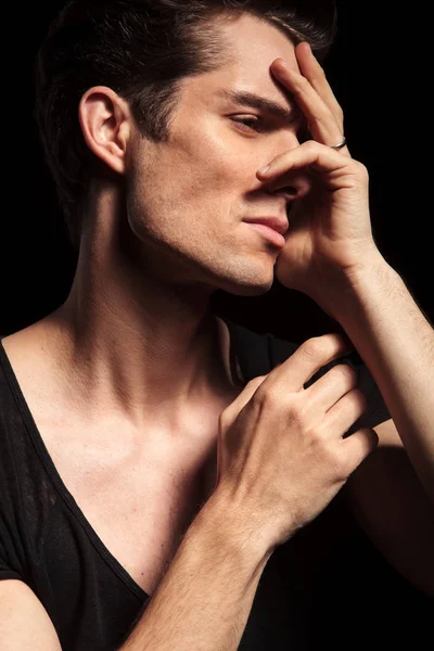 Closeup of a sad man with hands on his face — Stock Photo, Image