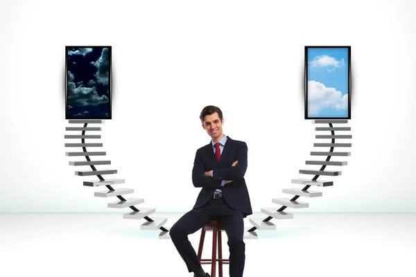 Seated happy business man in front of a big decision — Stock Photo, Image