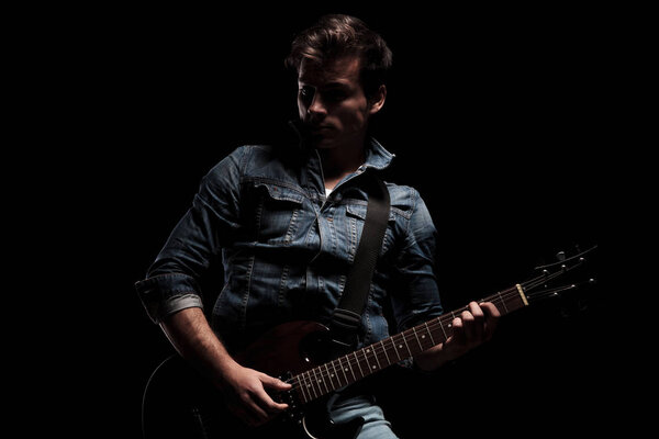 dramatic electric guitar player