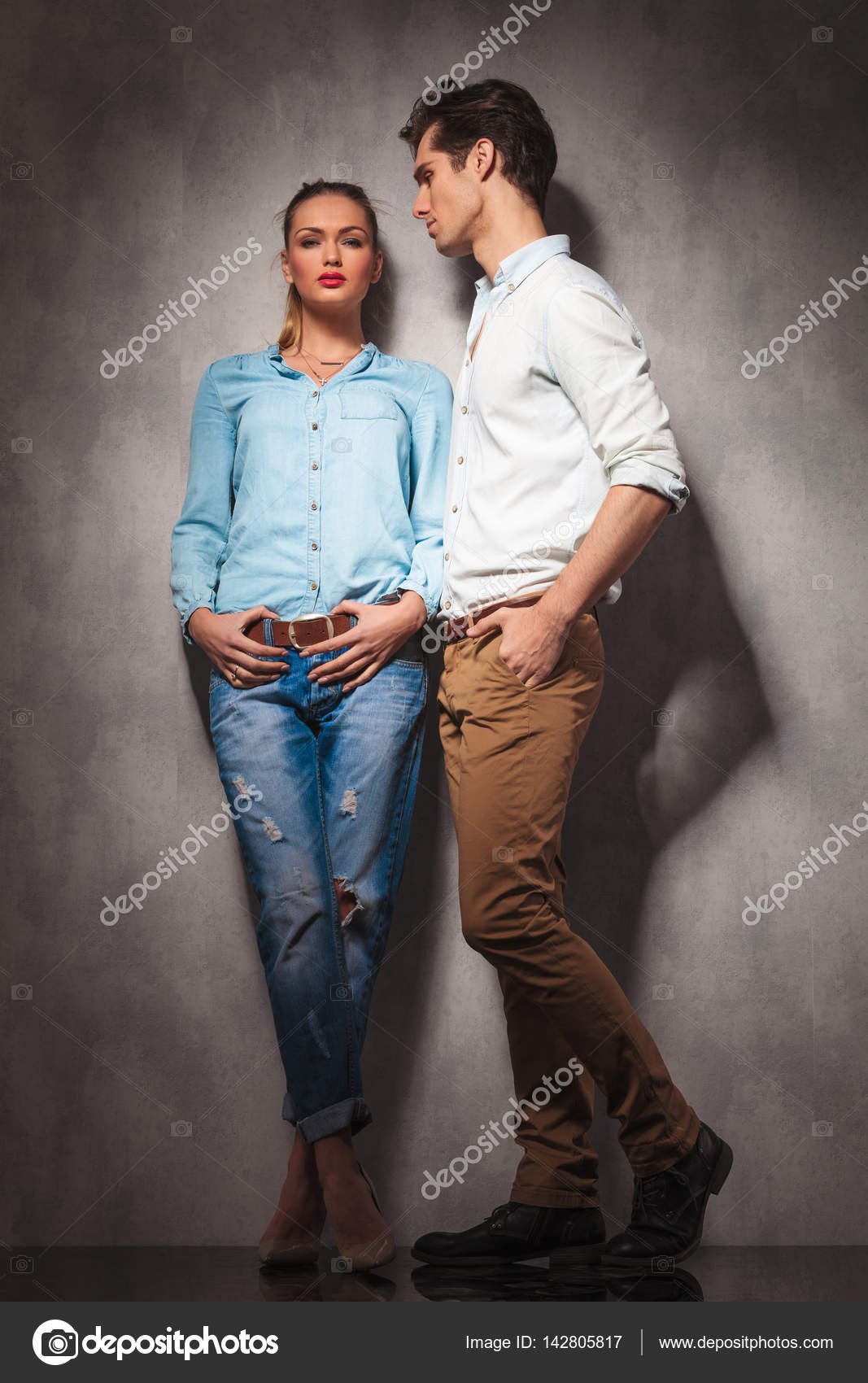 Young Casual Couple Pose in the Wind Stock Image - Image of blown, outdoor:  38681267