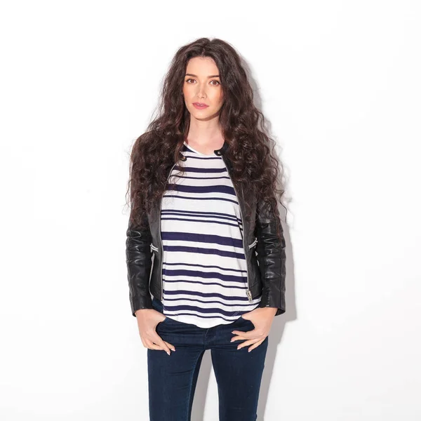 Young curly woman wearing leather jacket — Stock Photo, Image