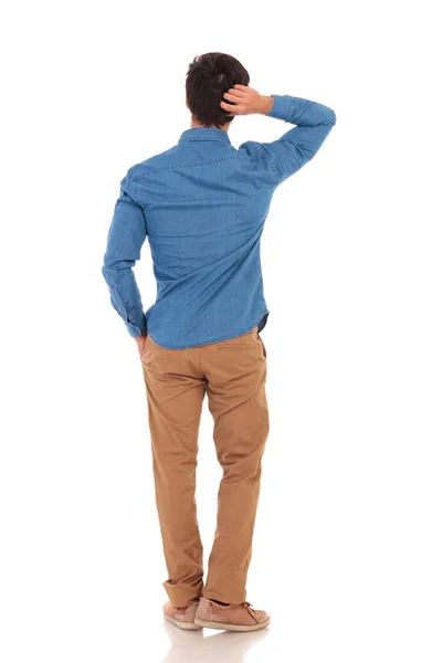 Back view of a pensive man scratching his head — Stock Photo, Image