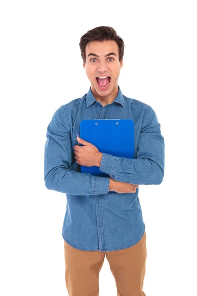 Shocked student holding clipboard and screams — Stock Photo, Image