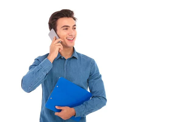 Side view of a young student speaking on the phone — Stock Photo, Image