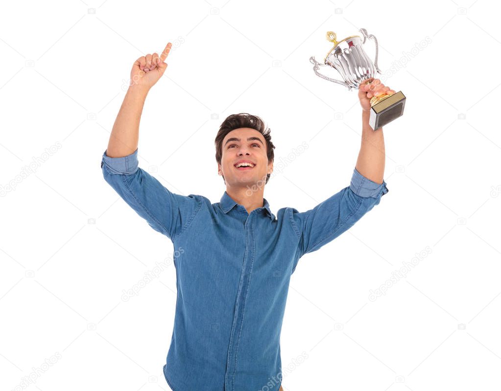 asual man with hands in the air celebrating success 