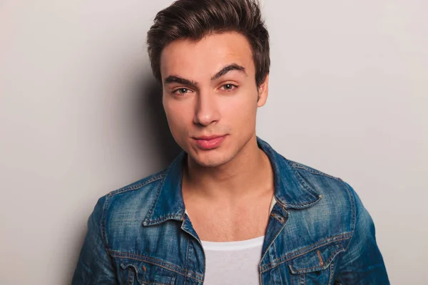 Face of a young man in jeans jacket — Stock Photo, Image