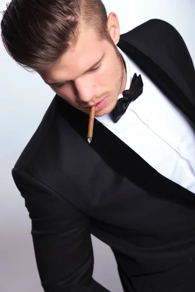 Top view of business man with cigarette in mouth — Stock Photo, Image