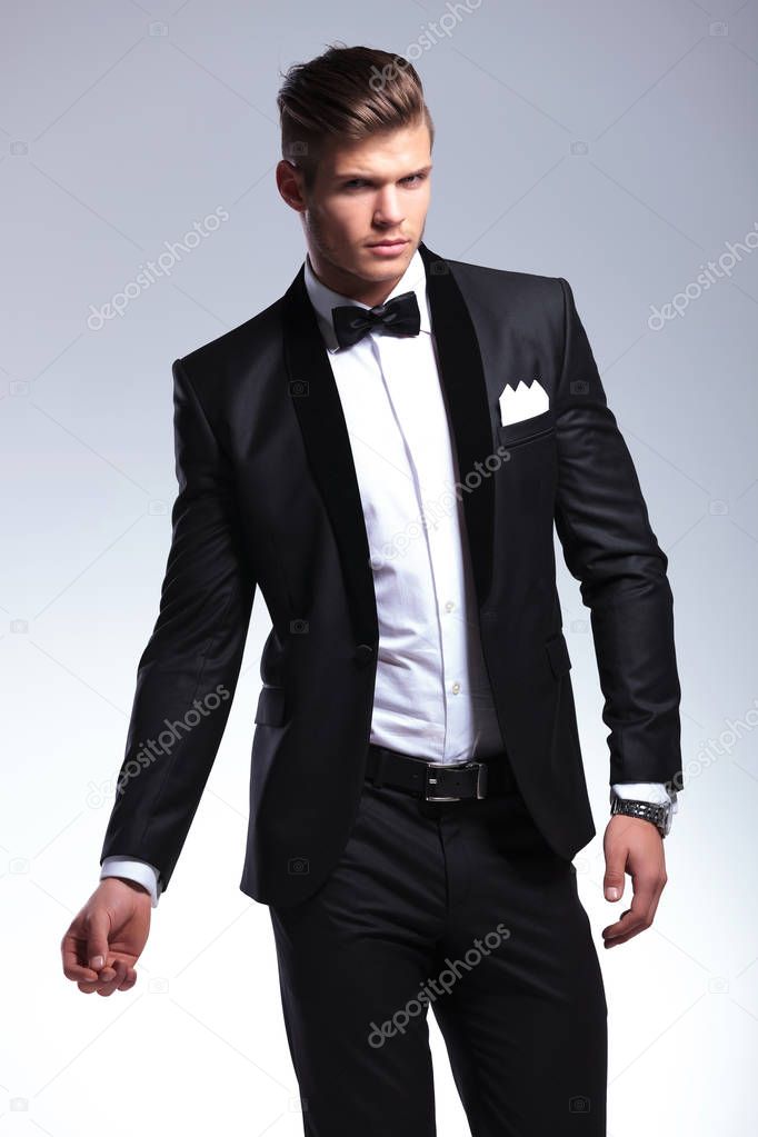 business man posing on gray