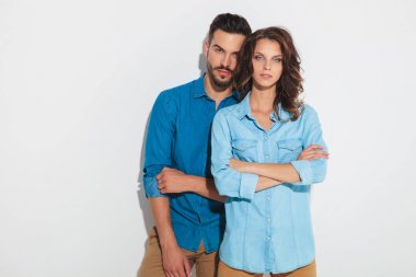 confident casual woman in front of her man clipart