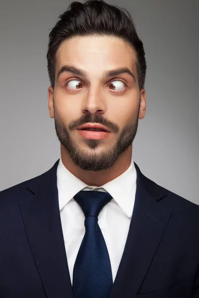 Young cross eyed business man smiling — Stock Photo, Image