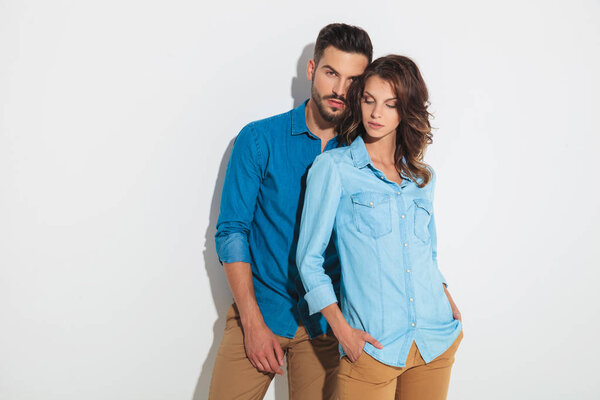 woman standing with hands  in front of her boyfriend 