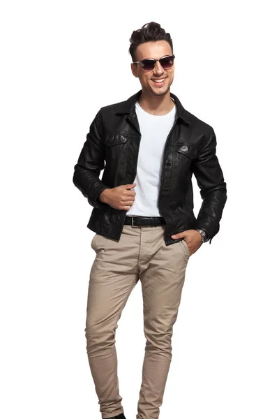 Laughing sexy man wearing sunglasses and leather jacket — Stock Photo, Image