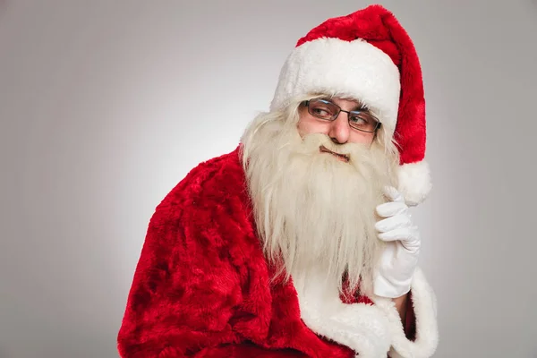 Zijaanzicht van santa claus denken — Stockfoto