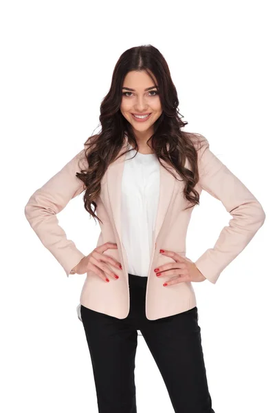 Young happy business woman posing with hands on waist — Stock Photo, Image