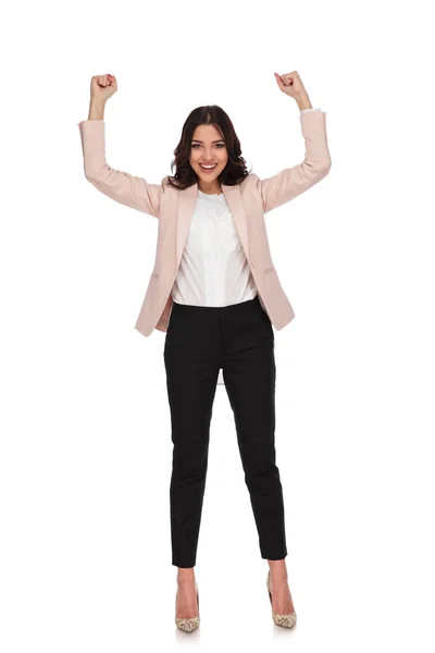 Excited young business woman with hands up and fists closed — Stock Photo, Image