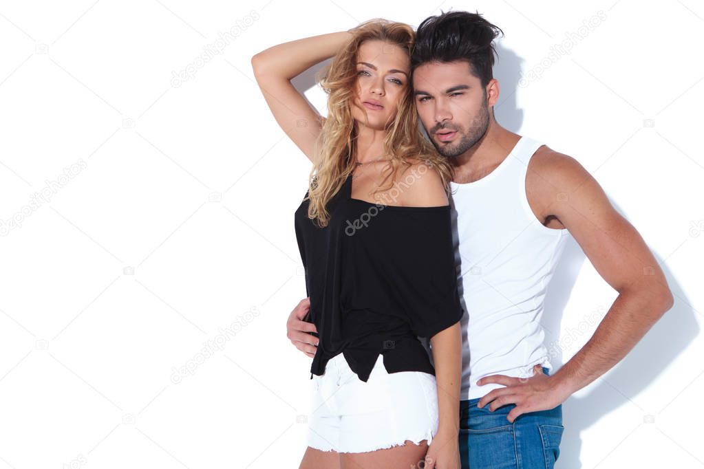 young sexy woman embraced by man